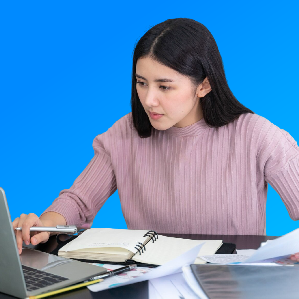 A girl watching towards laptop screen